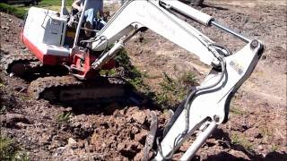 Mini Excavator Working a Steep Slope [upl. by Aicilaanna]