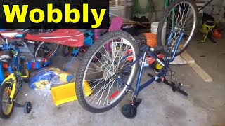 How To Straighten A Wobbly Bicycle WheelTutorial [upl. by Bone]